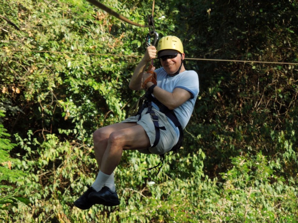 Allen M. Lawrence zip lining through the tree tops in a Costa Rican jungle